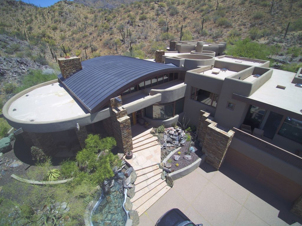 A curved standing seam metal roof on a home in Arizona.