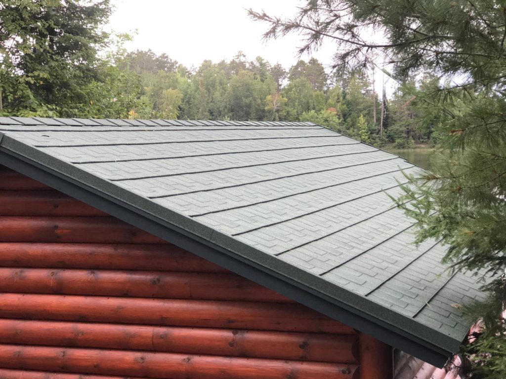 A gray stone coated steel roof that looks like shakes.