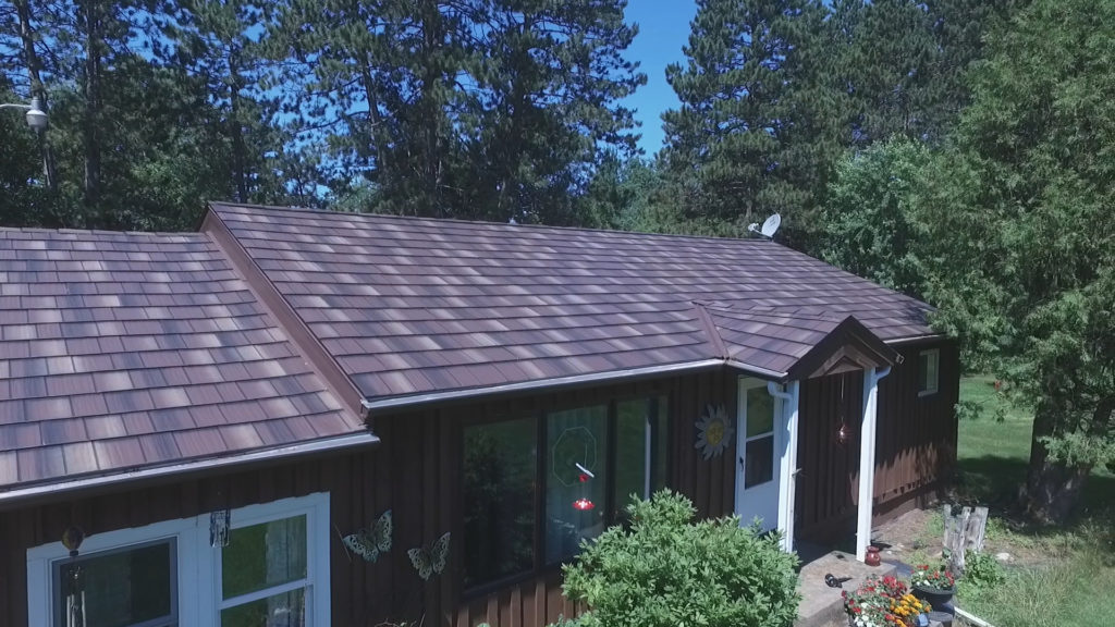 a home with a multi-tone metal shake roof.