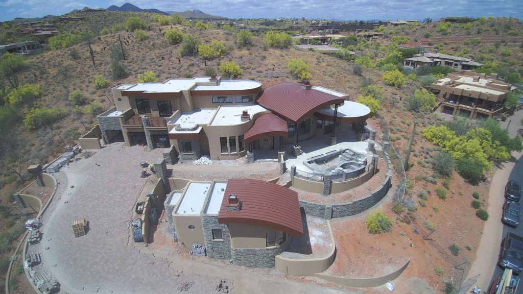 A home with curved metal roof sections