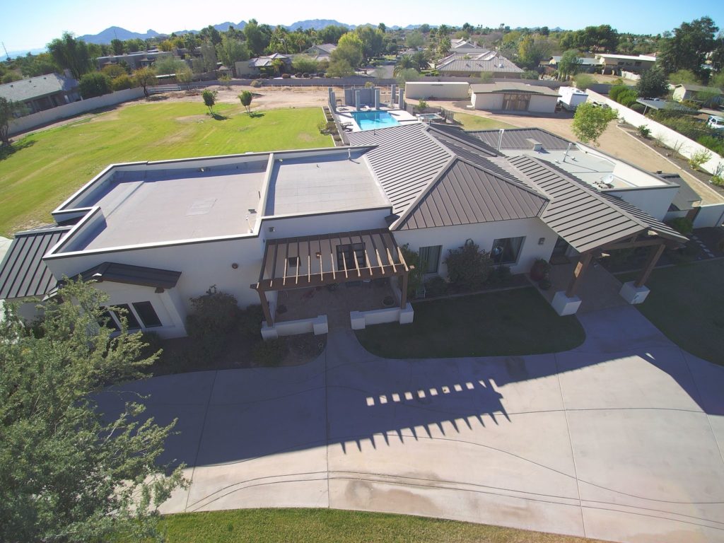 A house with a metal roof at different pitches.