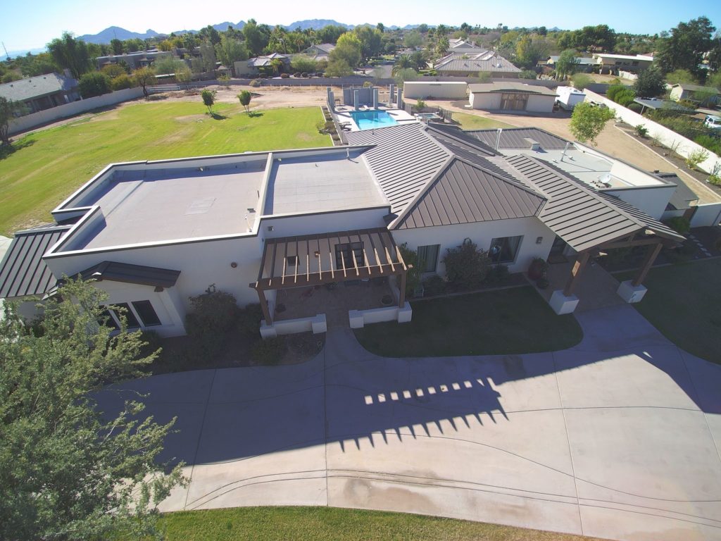 A house with a metal roof at different pitches.