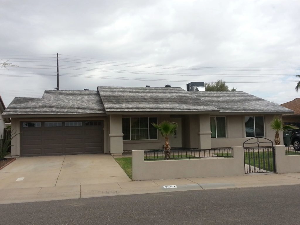 a home with a multi-tone metal slate roof.