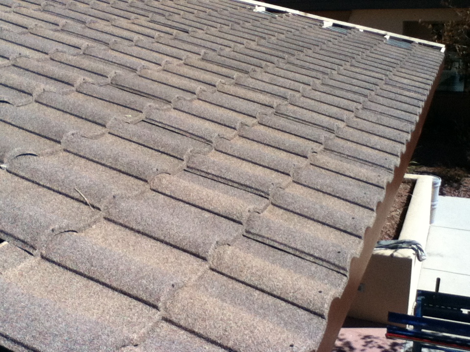 Closeup image of stone coated steel metal roof.