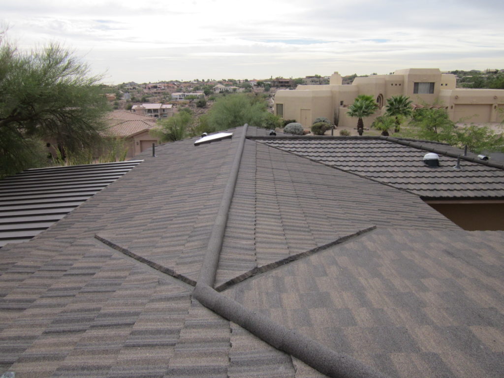 An overhead closeup view of a brown standing seam metal roof.