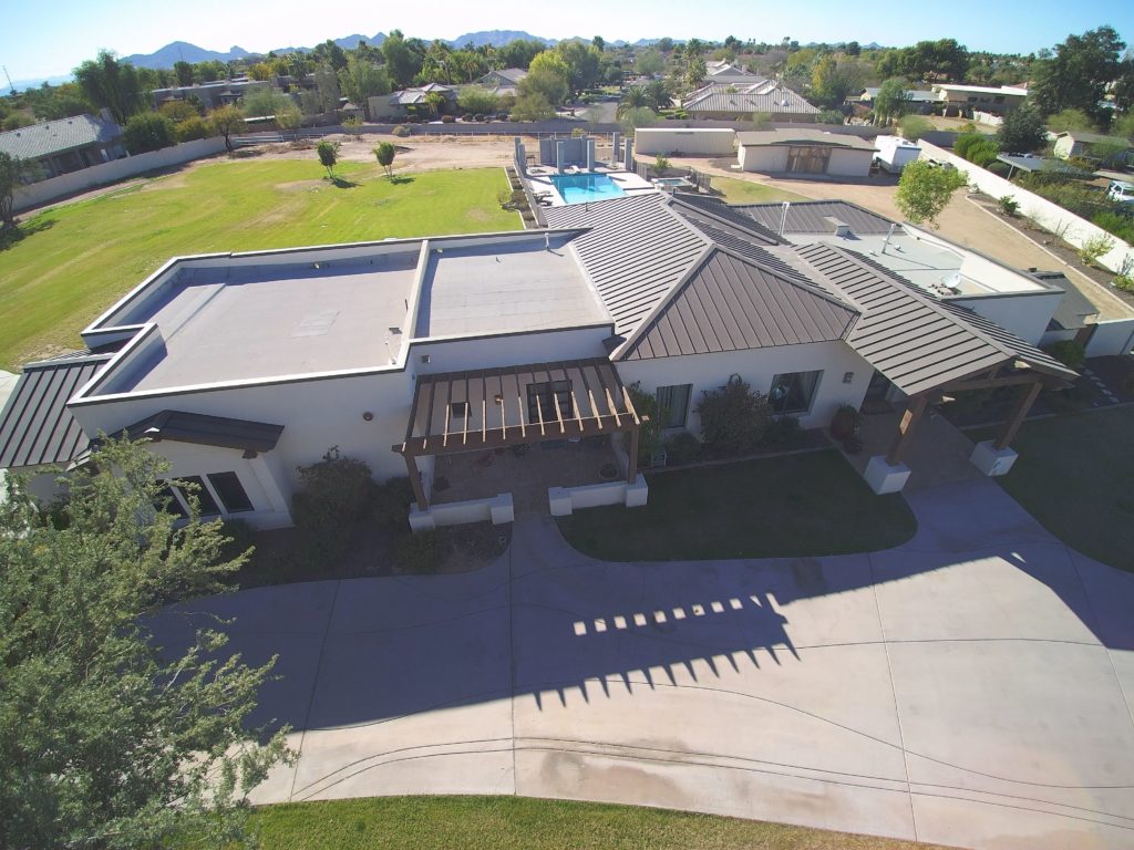 a standing seam metal roof with various pitches on a home in Arizona.