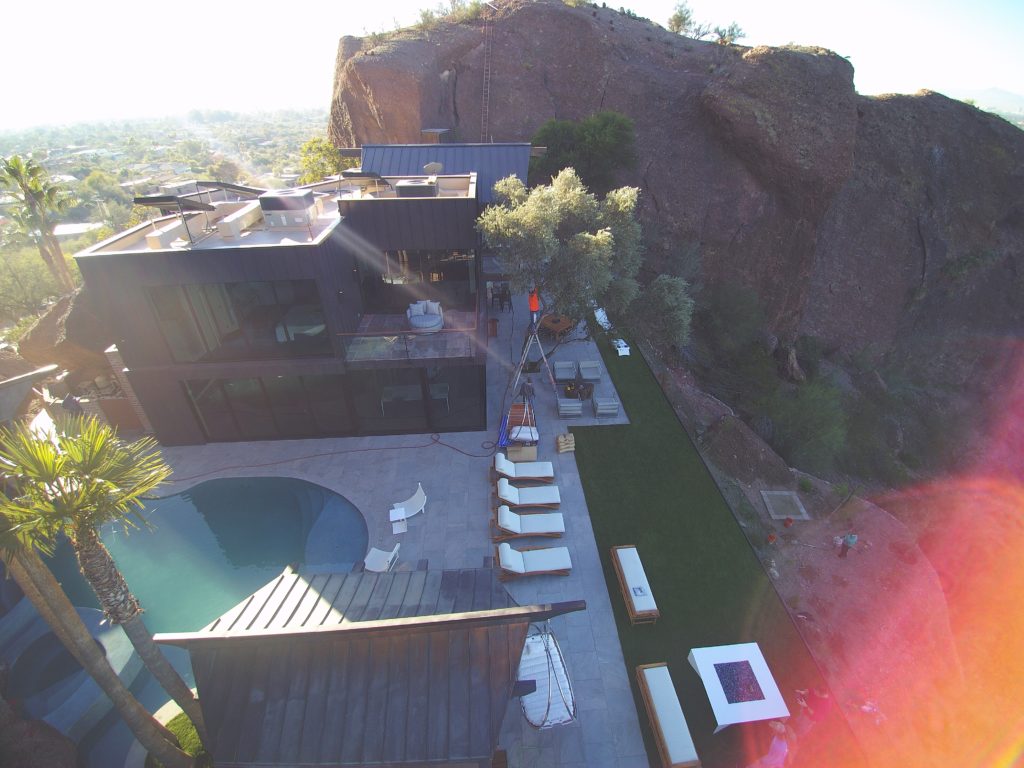 A home with swimming pool and new wall panels installed by Vertex Metal Roofing