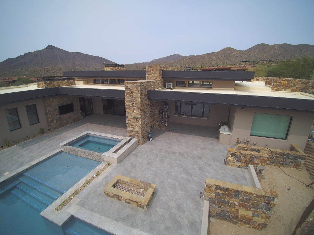 A courtyard view of an Arizona home with new soffit panels installed by Vertex Metal Roofing.