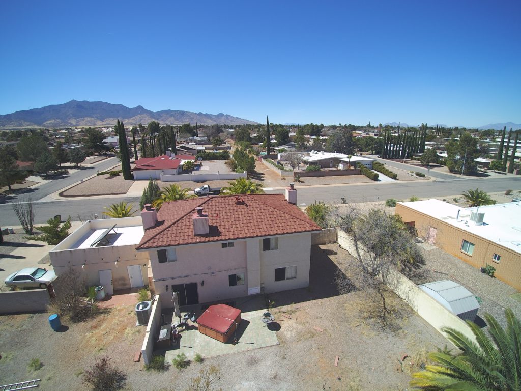 A drone image of an Arizona home with a new stone coated steel roof.