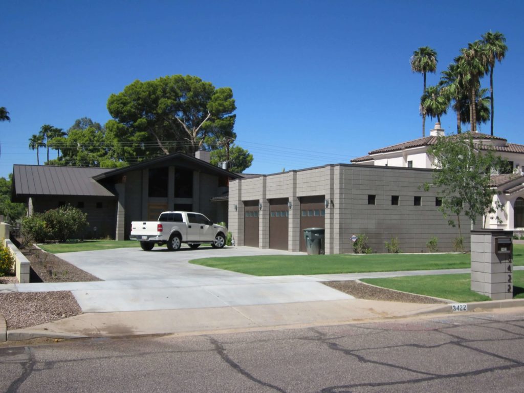 A modern home with a standing seam metal roof.