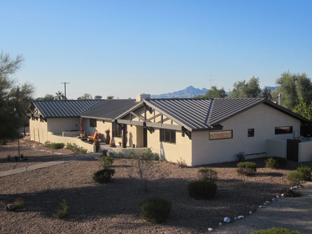 A finished project in Arizona with a new brown standing seam metal roof.