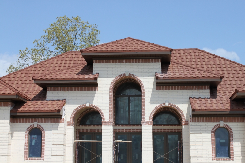 Clay coated Metal tile roof on spanish style home